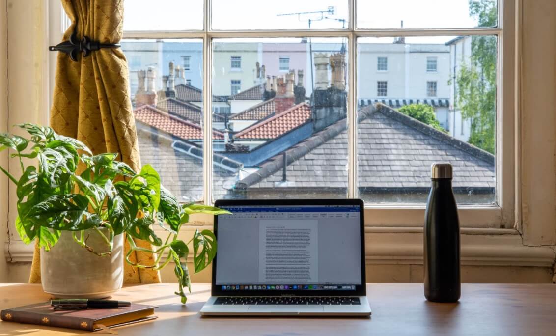 How to Stay Productive Working from Home (Desk Stock Photo)